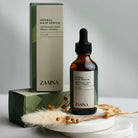 Herbal hair serum bottle promoting natural hair growth and nourishment for healthy, shiny hair care