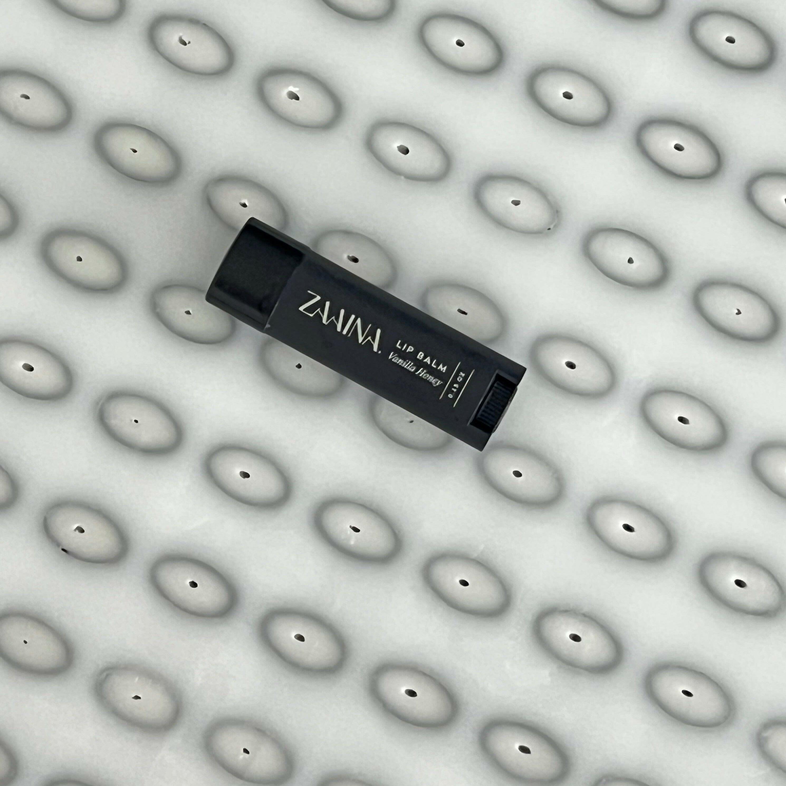 Natural lip balm to hydrate and nourish lips, providing organic moisture for soft, healthy-looking skin.