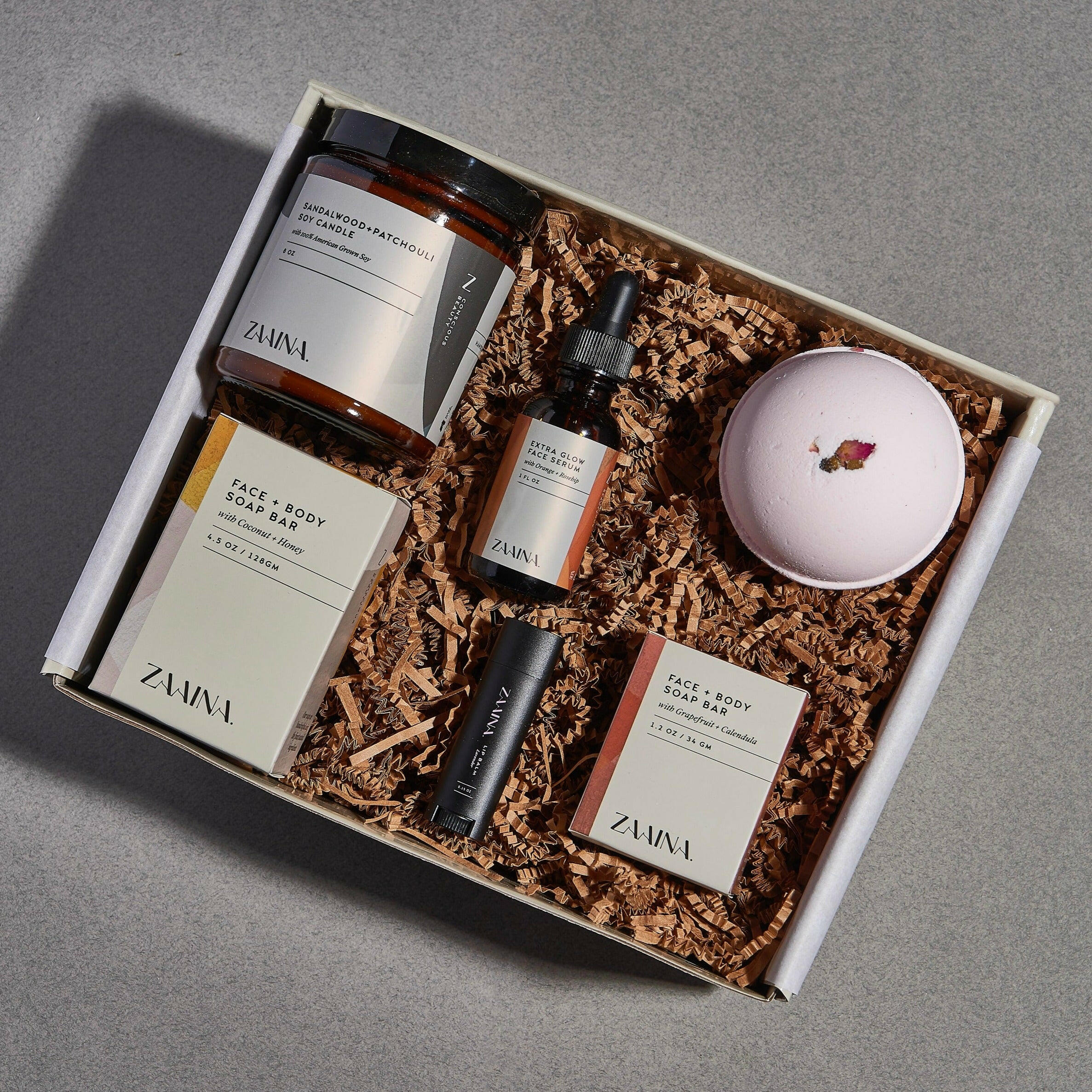 Luxurious spa box with rose and sandalwood products, perfect gift set for relaxation and rejuvenation.