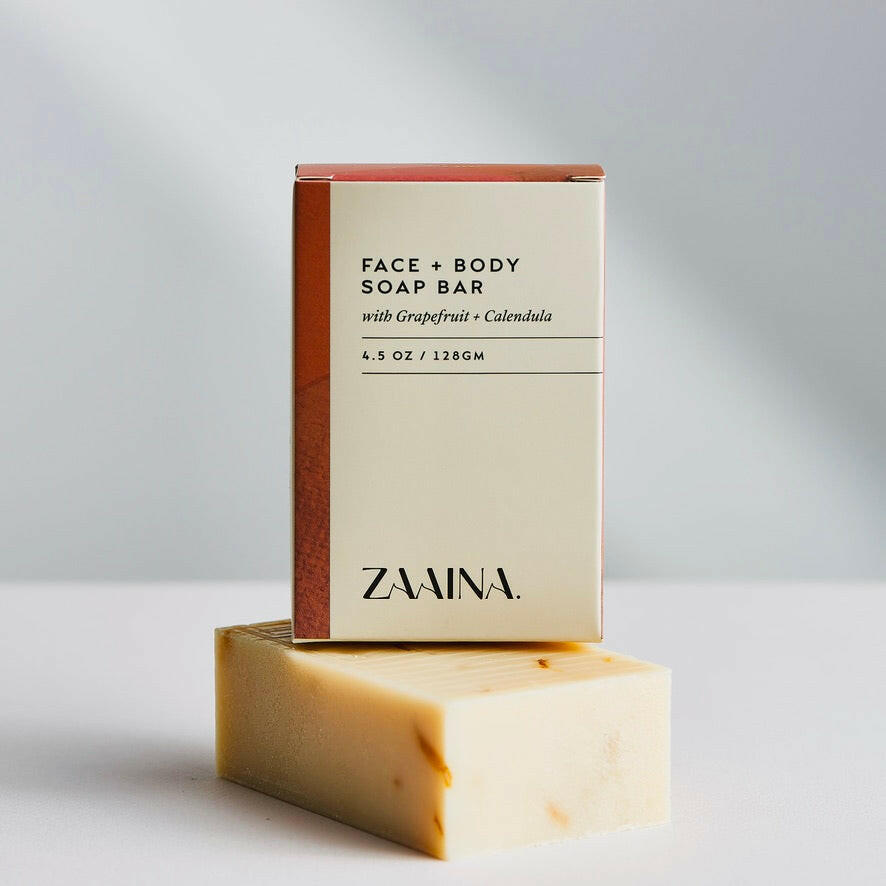Handcrafted soap featuring grapefruit and calendula for natural skin care, gentle cleansing with herbal ingredients.