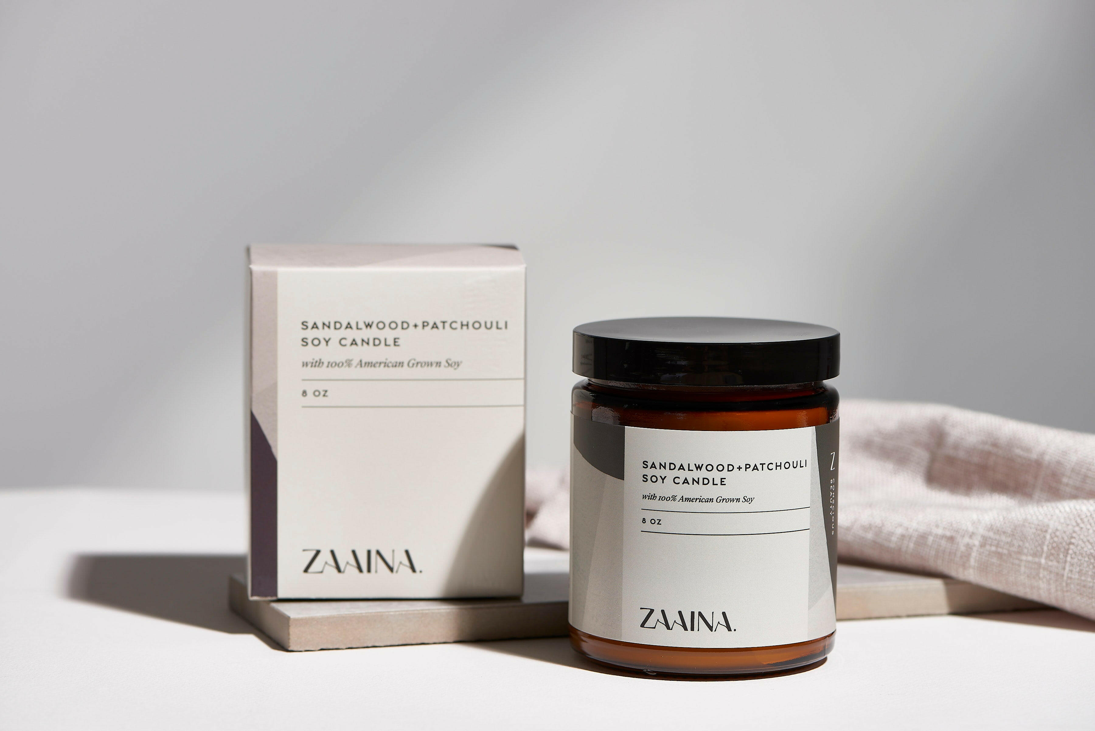 Premium Sandalwood soy candle in glass jar, eco-friendly and long-lasting fragrance for home decor.